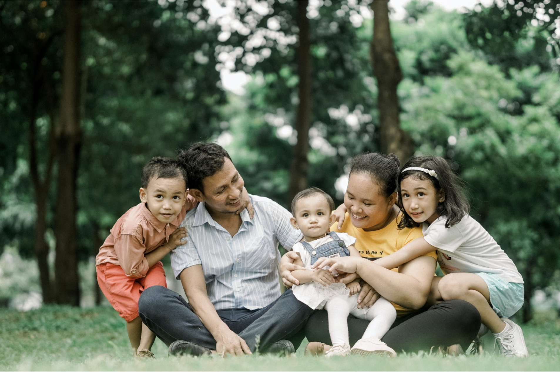 family playing in a park