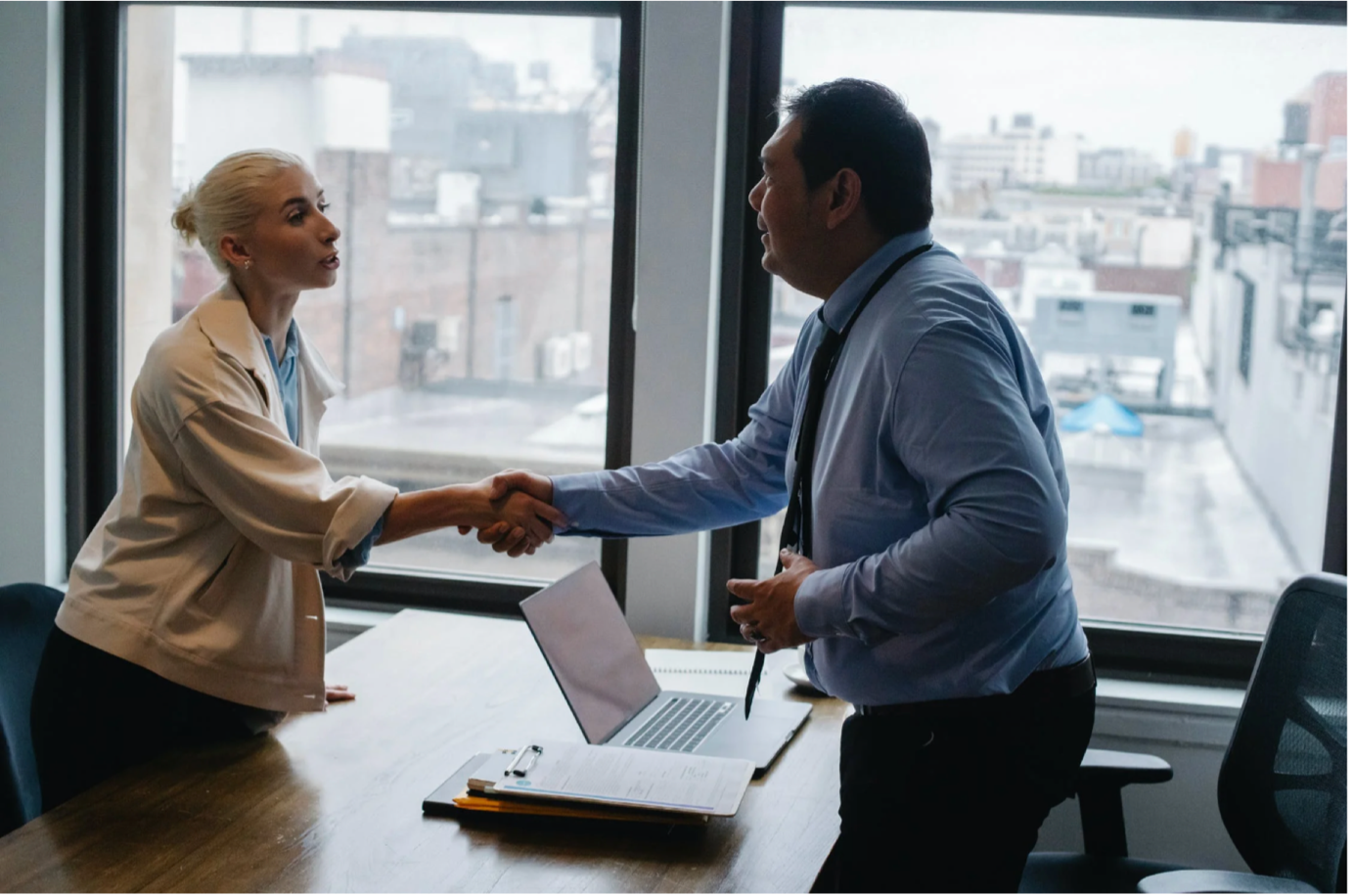 two people shaking hands after an interview